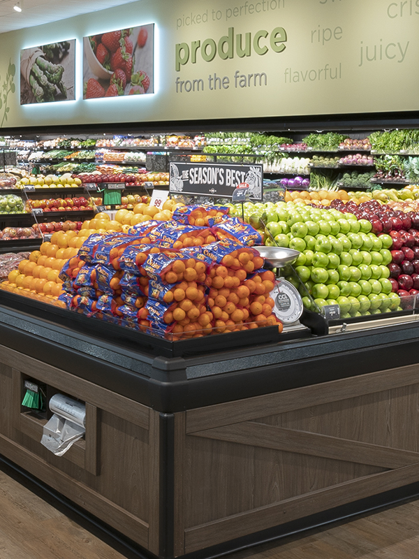 In-Store Photo of Stater Bros. Markets Produce Department with stacks of Oranges, Apples, Lettuce and More.