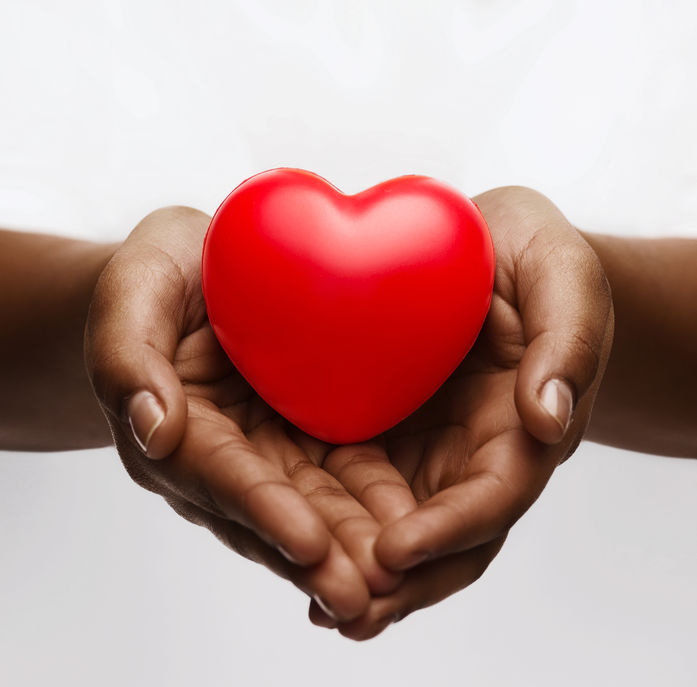 Image of hands holding red heart