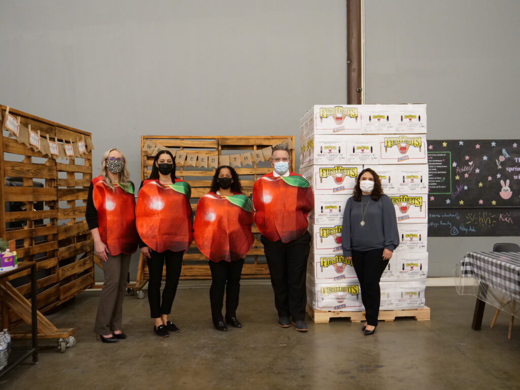 Image of SB employees in apple costumes