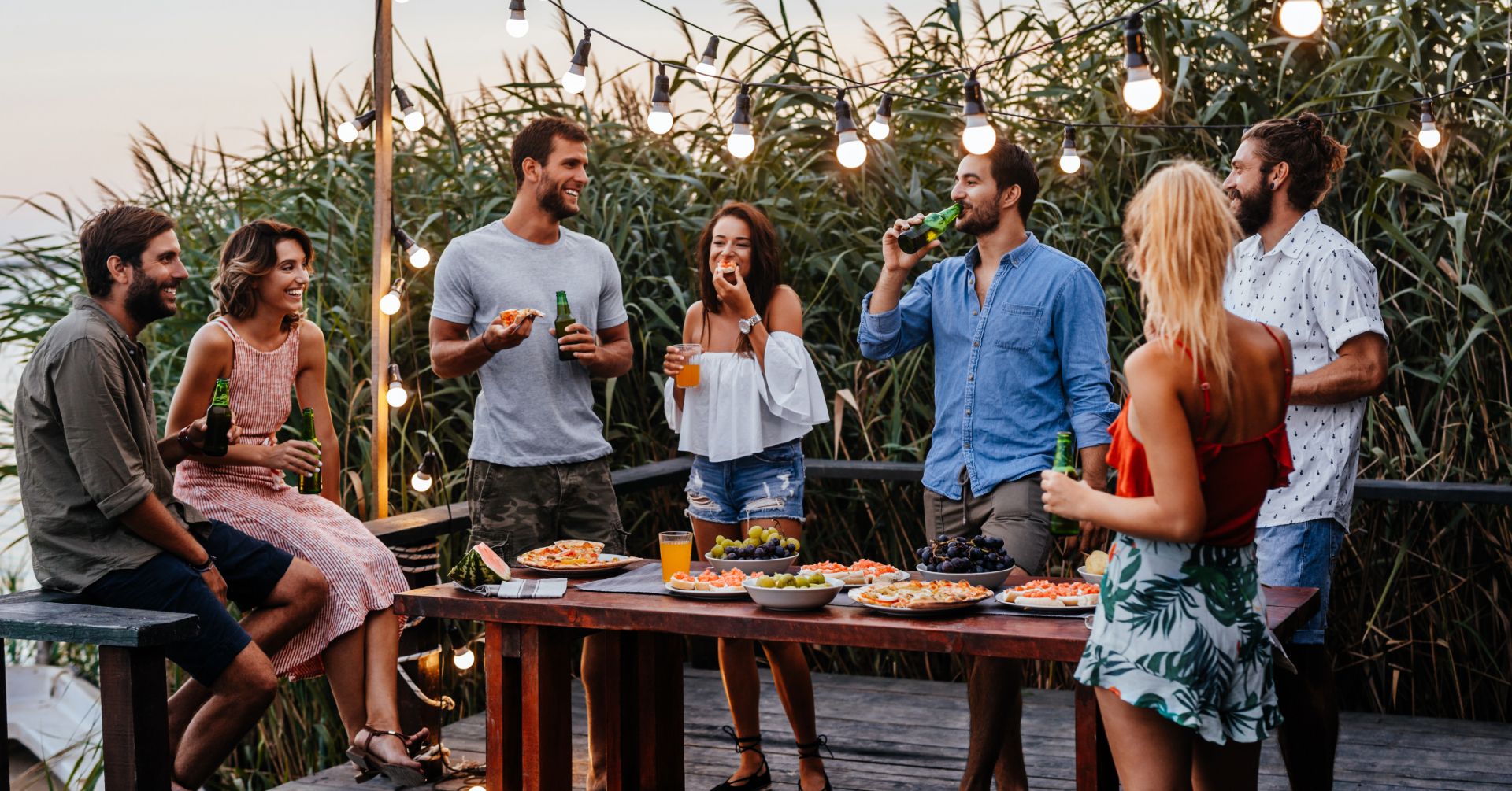 group of friends enjoying a cookout during summer.