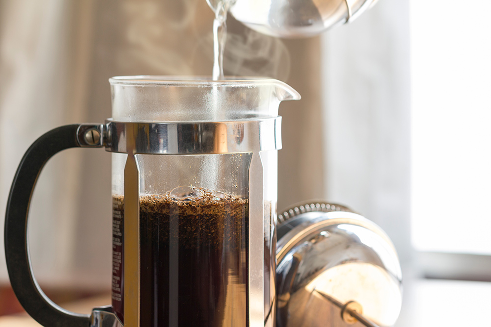 Coffee brewing in a french press.