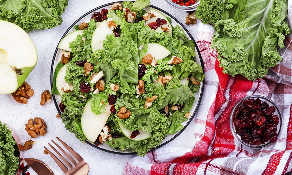 A fresh kale, apple, and walnut salad.