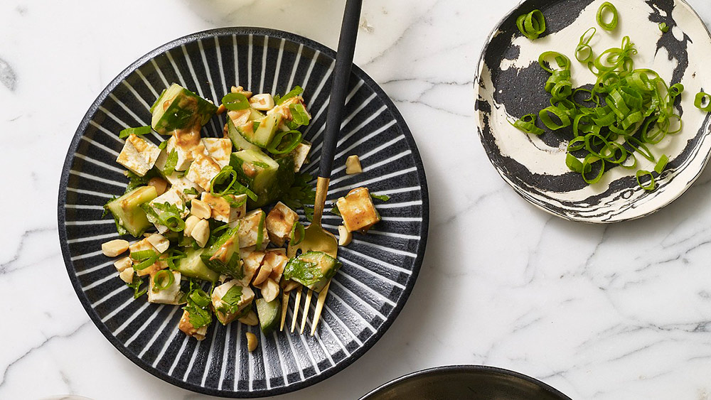 Vegan tofu and cucumber salad with spicy peanut dressing.