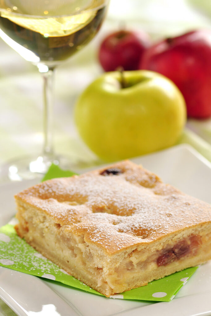 A sweet cake dessert served with Moscato D'Asti wine.