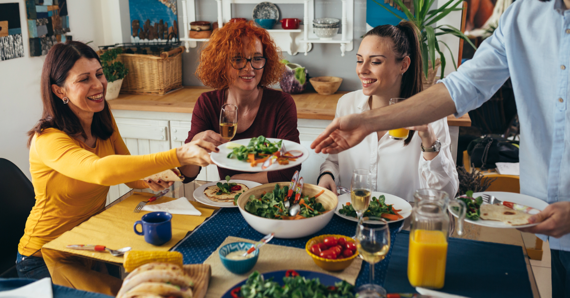 Family gathering while eating salads.