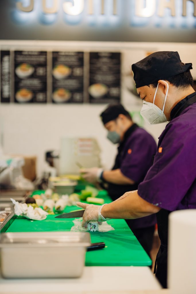 Stater Bros. Markets In-House Sushi Chefs Preparing Multiple Sushi Rolls