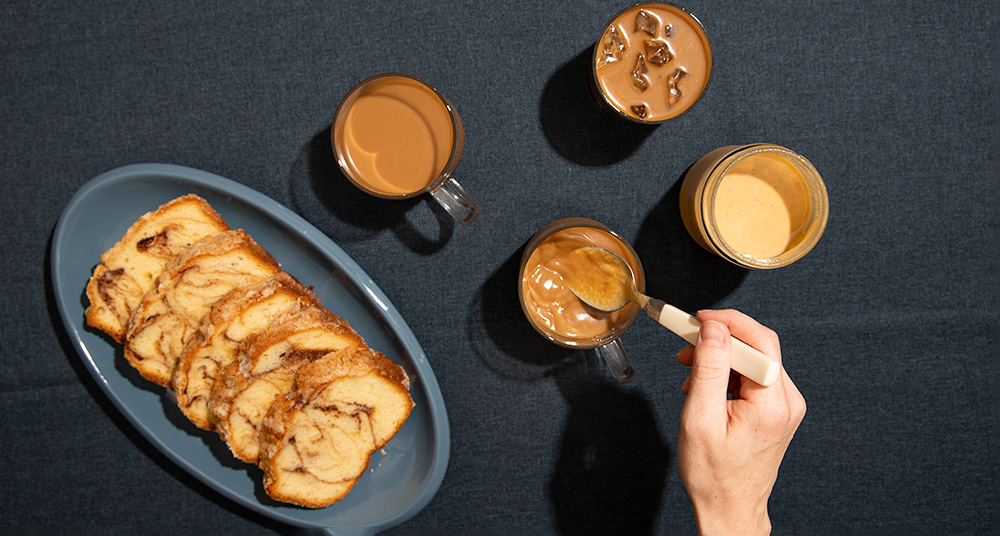 Pumpkin Spice desserts, drinks, and sauce spread out on a table.