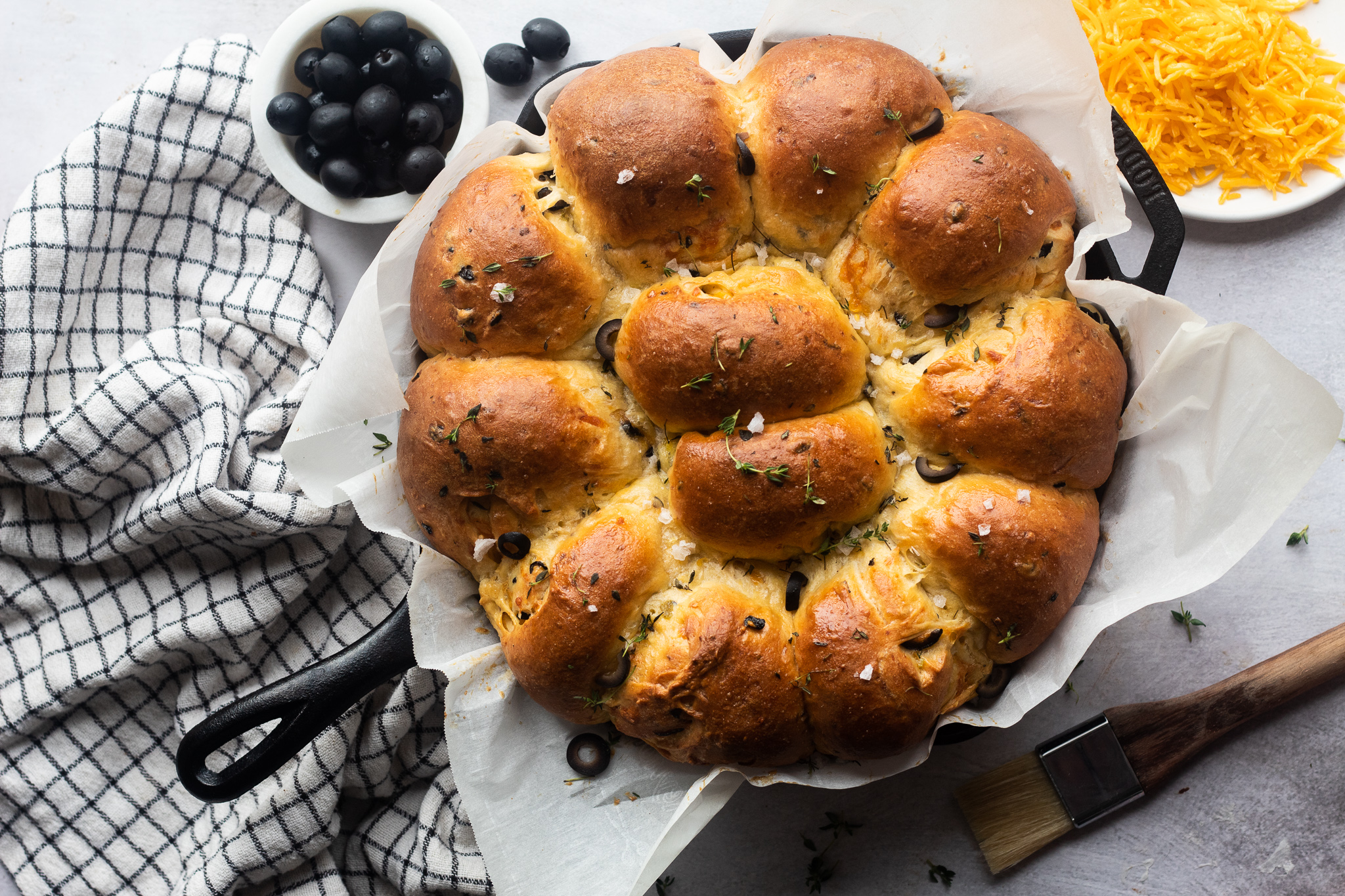 Cheese stuffed green chile olive bread served warm with flaky salt.
