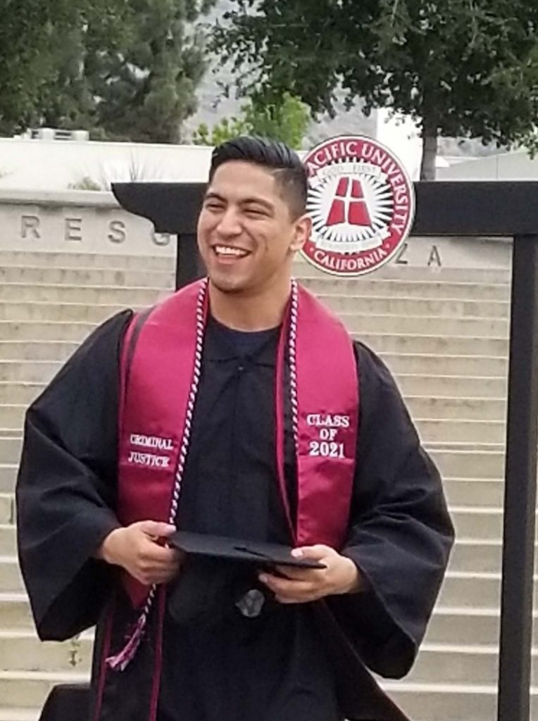 Anthony Pallanes, posing after commencement from Azusa Pacific University.