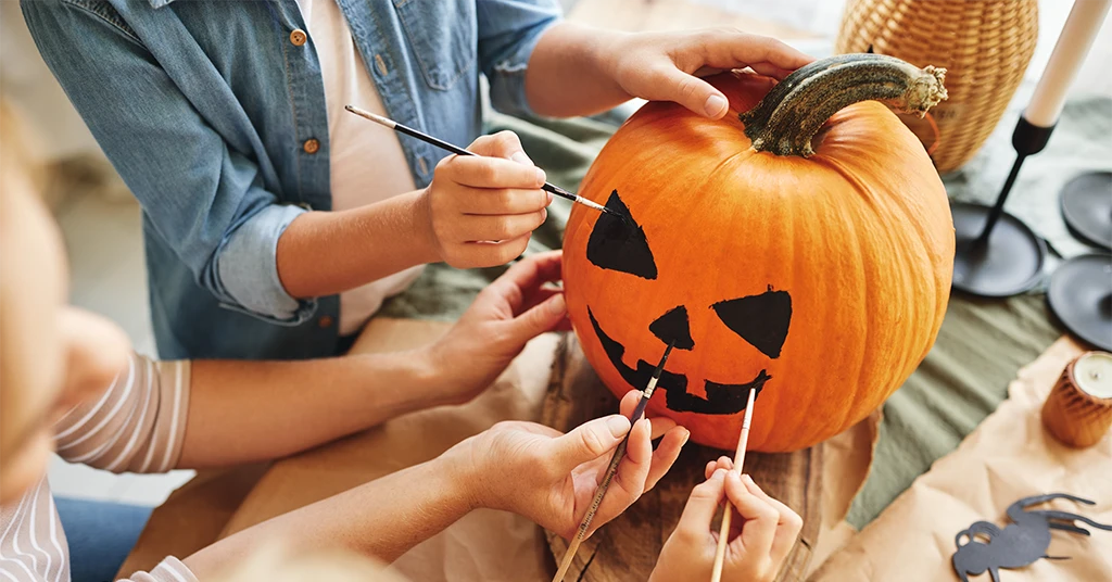 Painting pumpkin face 