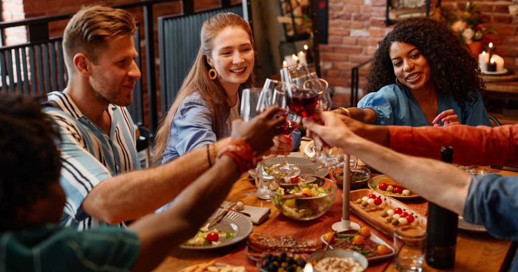 Group of friends having Friendsgiving dinner with food from Stater Bros. Markets.