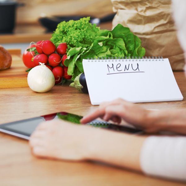 Woman meal prepping her weekly meals.
